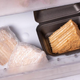 Cake wrapped in plastic wrap in freezer